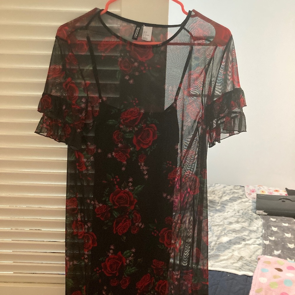 Mesh rose design with black dress underneath